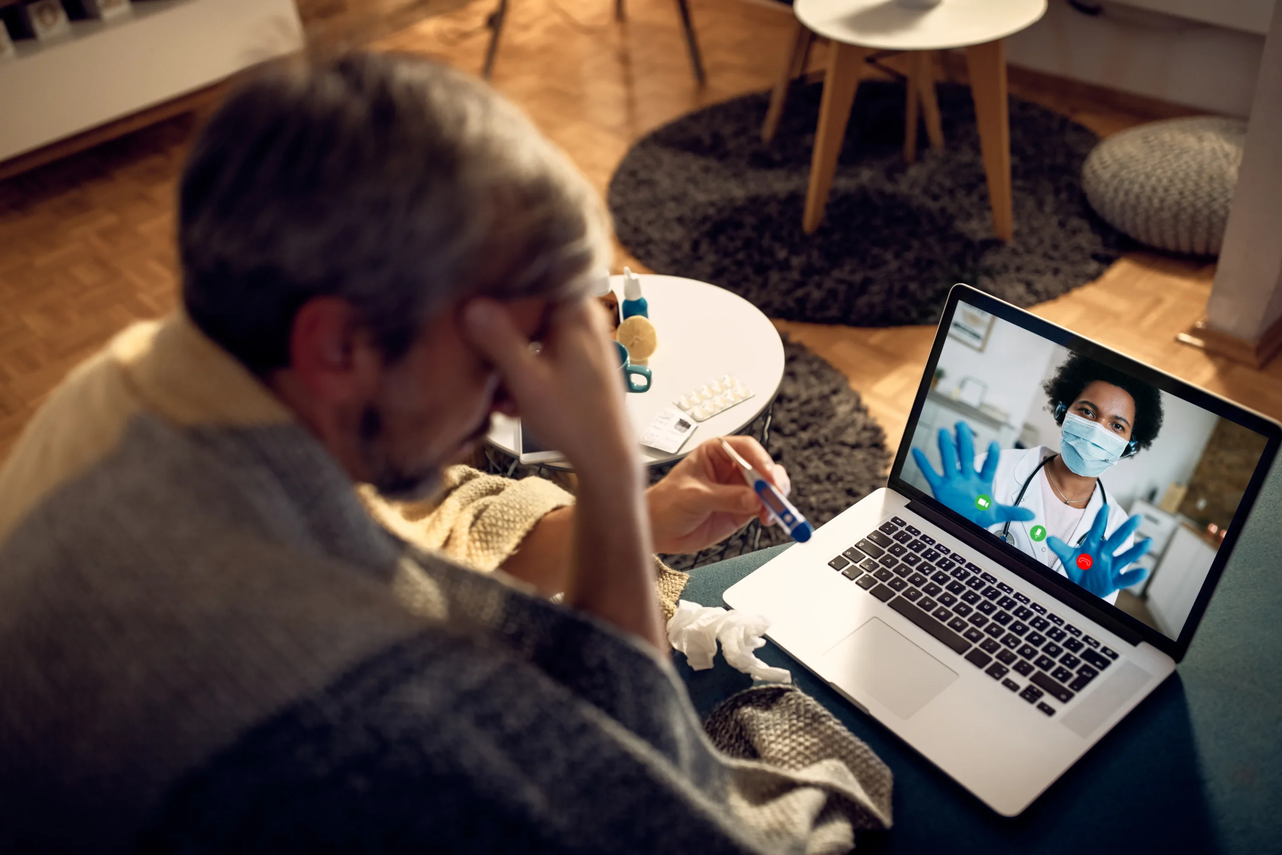 Patient experiencing symptoms conducting a virtual consultation when evaluating how to choose a doctor.